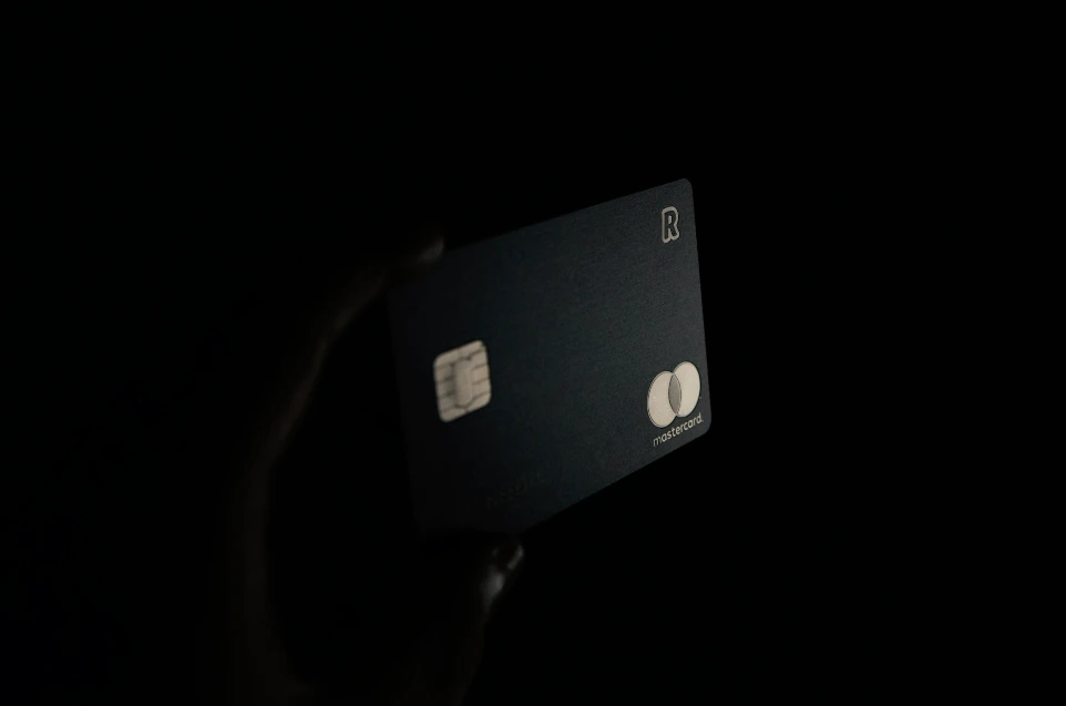 person holding black card